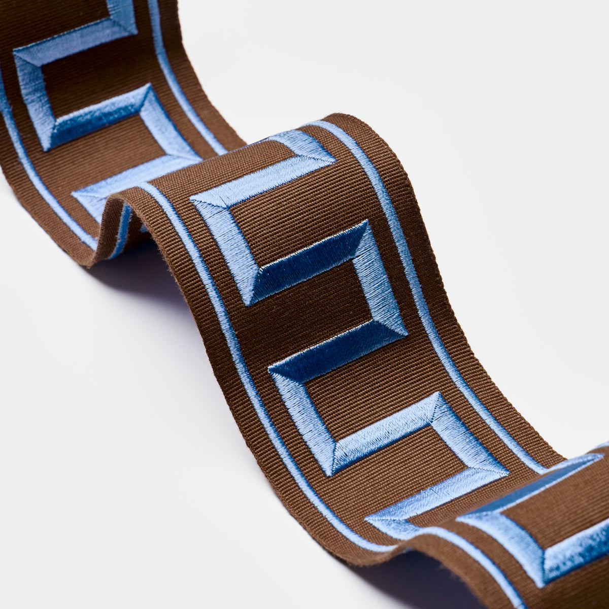 Schumacher 70807 GREEK KEY EMBROIDERED TAPE in BLUE ON BROWN