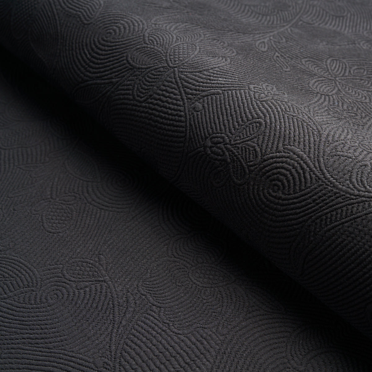 Schumacher Quilted Scroll Matelassé Pitch Black Fabric - Eade's Wallpaper
